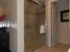 Shower is next to dressing table