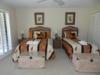 Parrot Room. Full size and twin bed. Sliding doors overlook lagoon