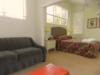 Sitting area in upstairs Master bedroom has a TV, DVD, & sofa bed