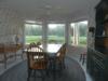 Breakfast room invites interest outside. Birds, leaping fish or golfers